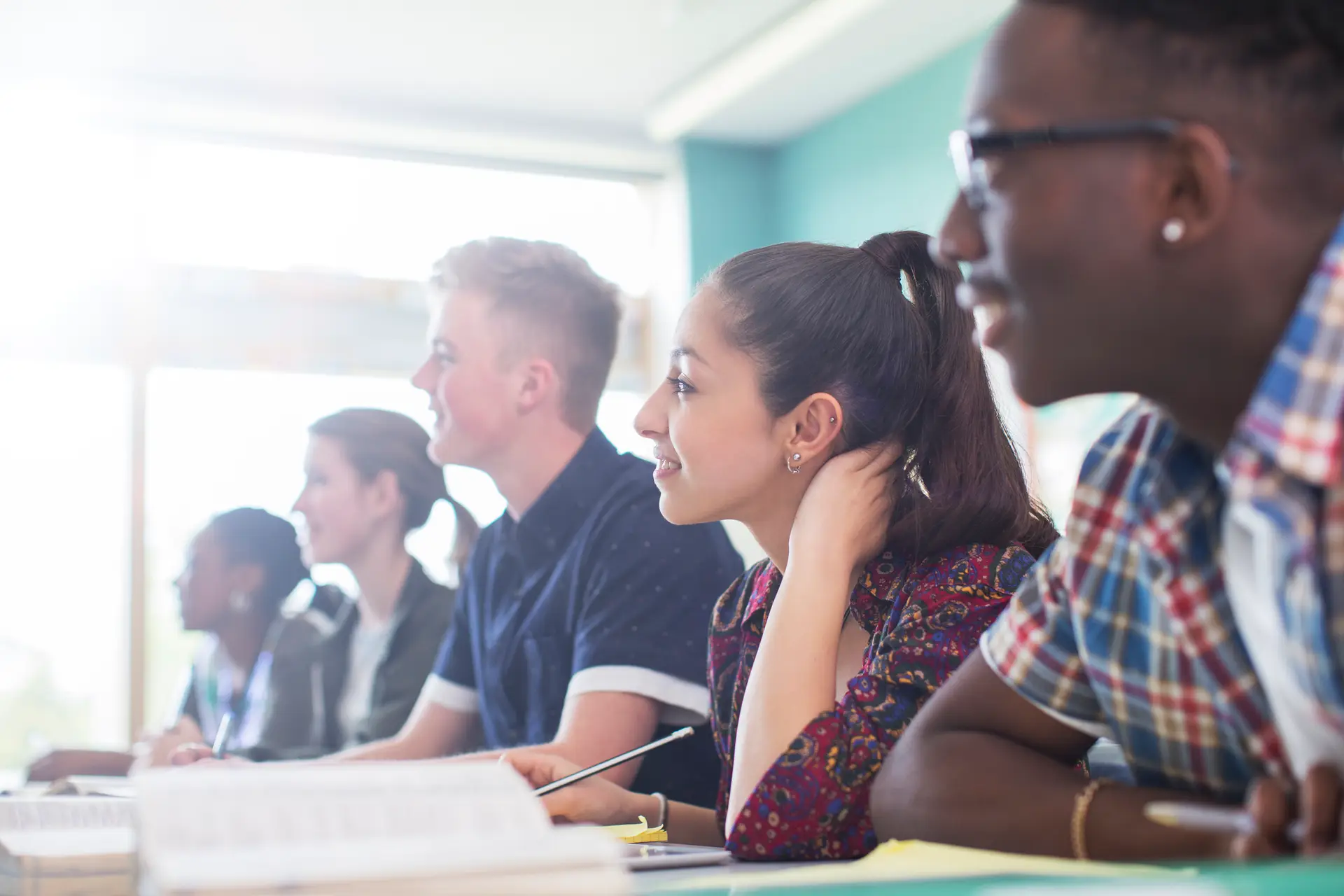 A group of students listening in a classroom