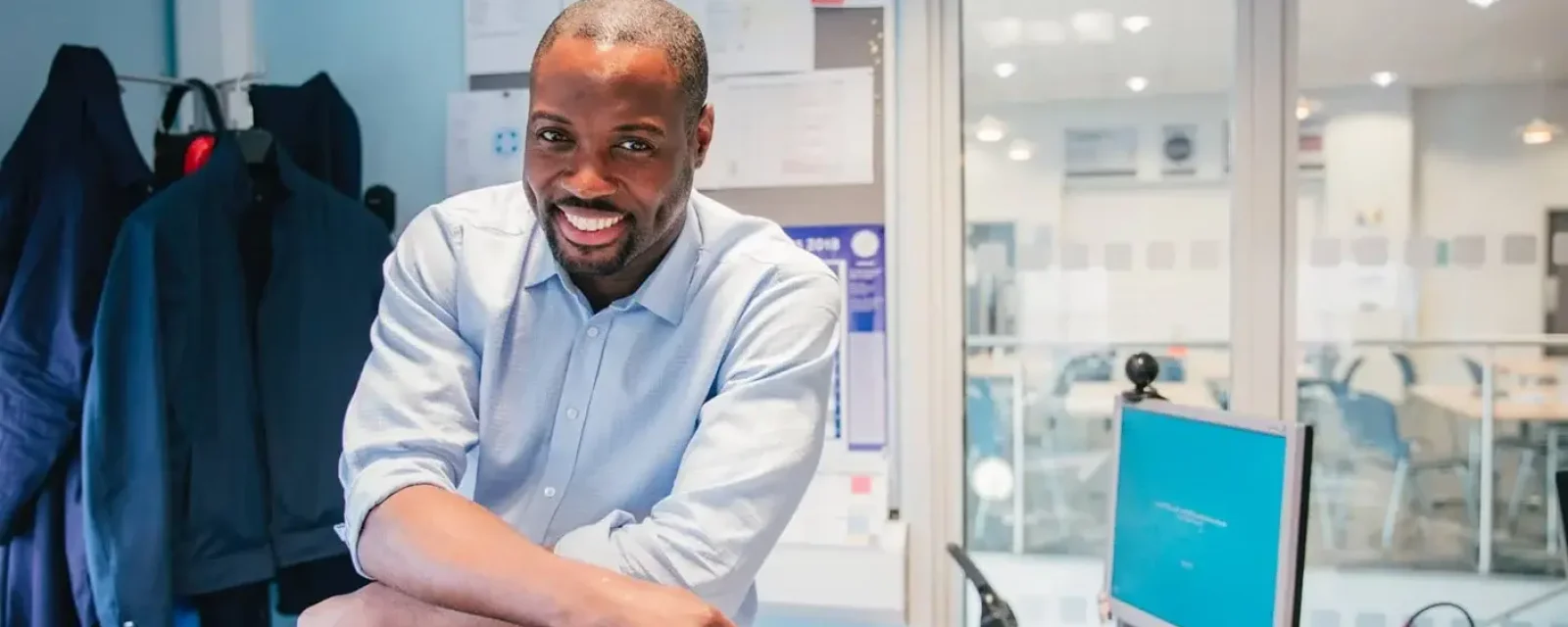 A manager smiling in their office